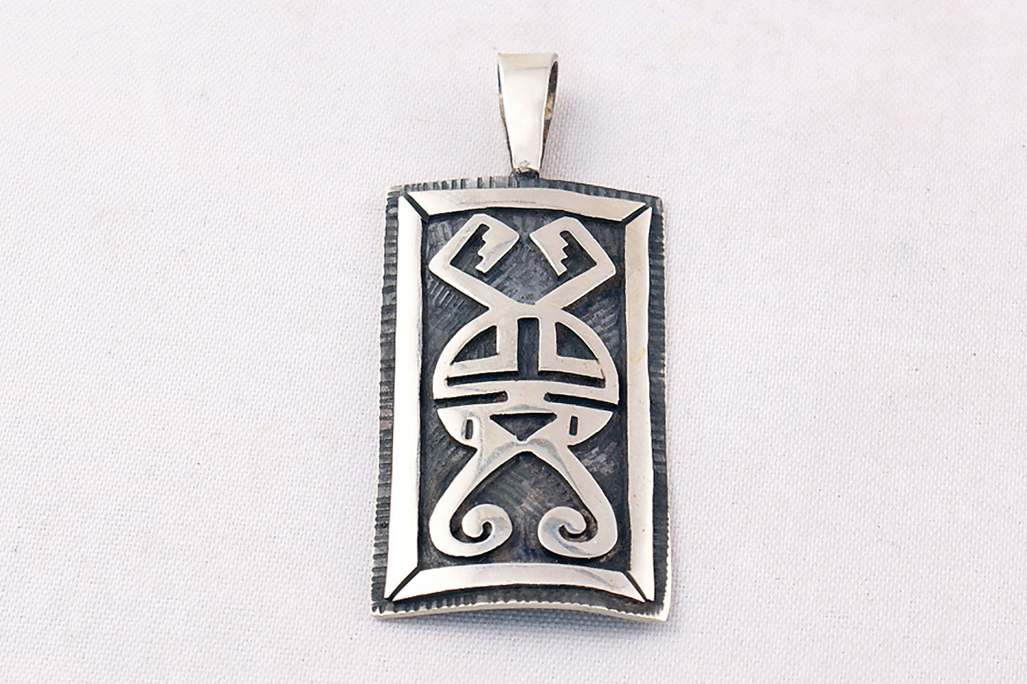 Hopi Overlay Sterling Silver Sunface Pendant by Clement Honie